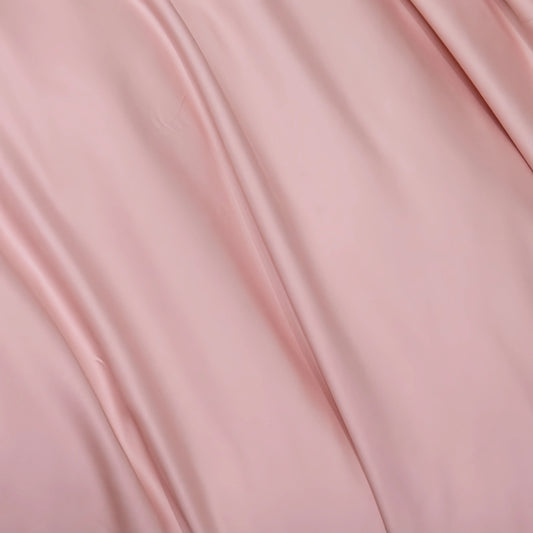 Soft blush pink 100% cotton doona cover with elegant drapes, perfect for cozy bedding sets.