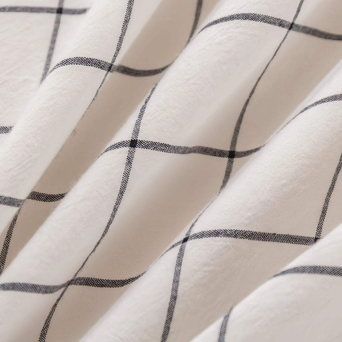 White cotton doona cover with black grid pattern, soft texture and elegant design