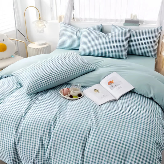 Blue and white gingham quilt cover set with matching pillowcases on a cozy bed