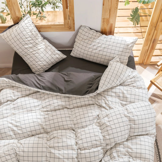 White grid pattern doona cover set with gray accents, styled in a cozy bedroom