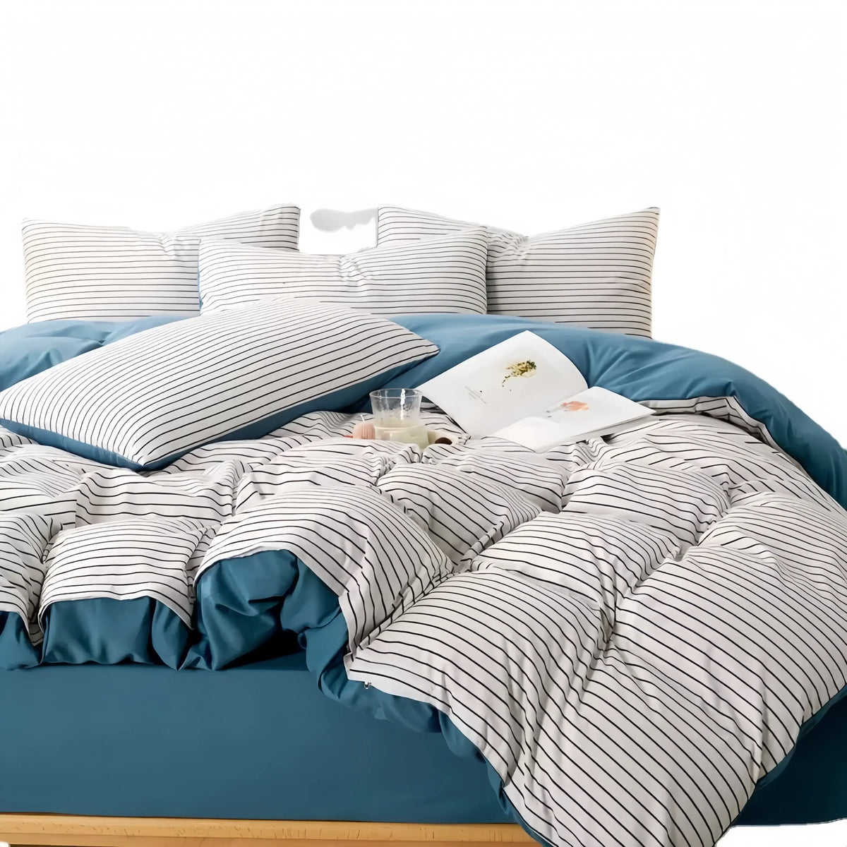 Blue and white striped cotton doona cover set with matching pillowcases on a bed
