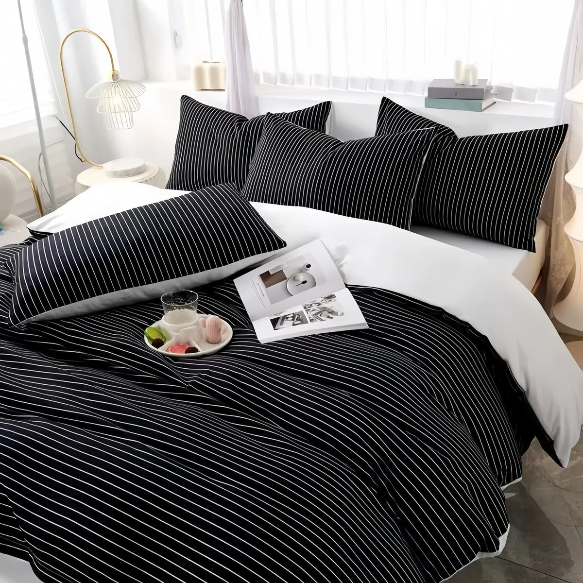 Black and white striped cotton doona cover set with matching pillowcases on a styled bed
