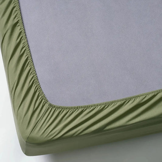 Olive green fitted sheet with elastic corner, 100% cotton, snug fit on mattress