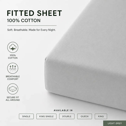 A fitted sheet in light gray shown on a bed corner, with text reading 'FITTED SHEET 100% COTTON' and feature icons for cotton, breathable comfort, and secure fit. Available sizes and color options are shown below.